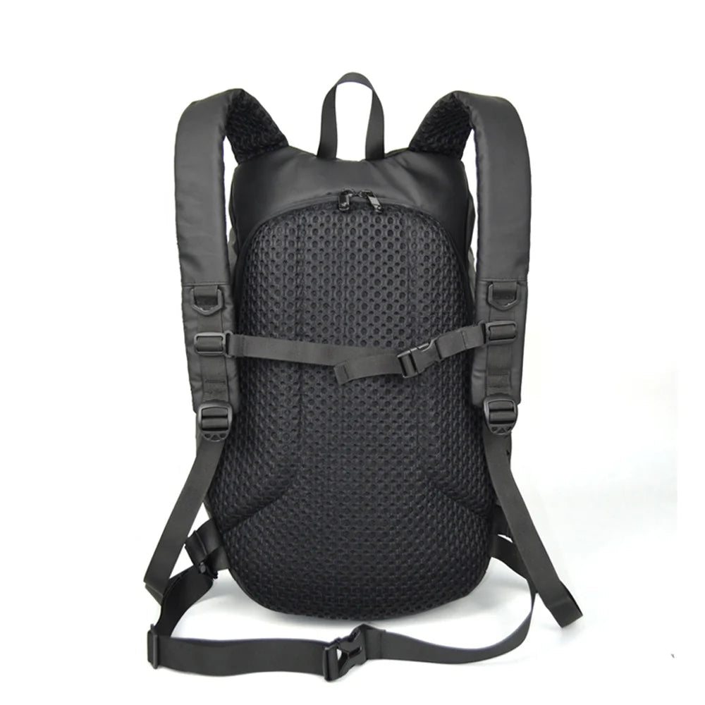 Black backpack with honeycomb pattern on a white background, featuring Moto Central logo.