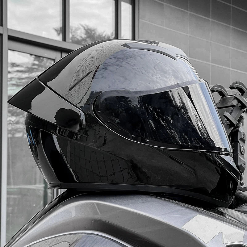 Black motorcycle helmet on a car with a blurred background