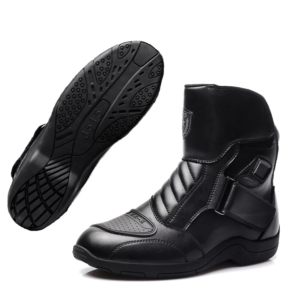 Black motorcycle boots with a visible brand logo on a white background