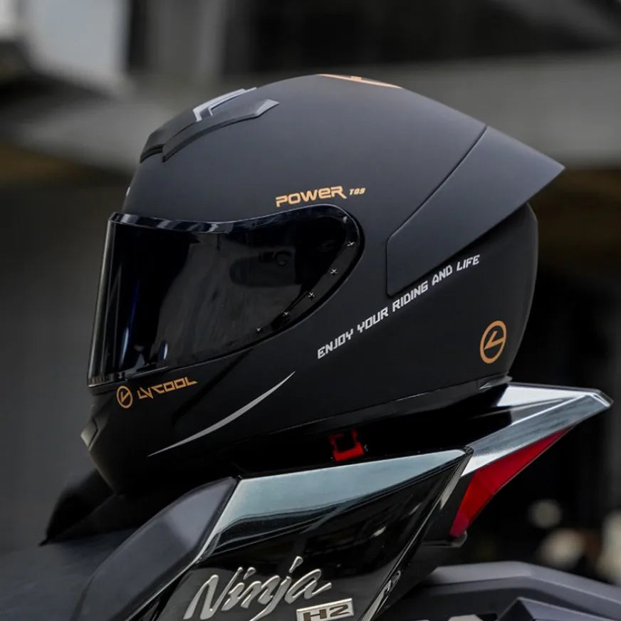 Black motorcycle helmet with text on a blurred background