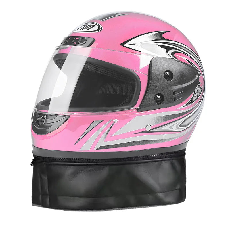 Pink and black motorcycle helmet with a clear visor on a white background