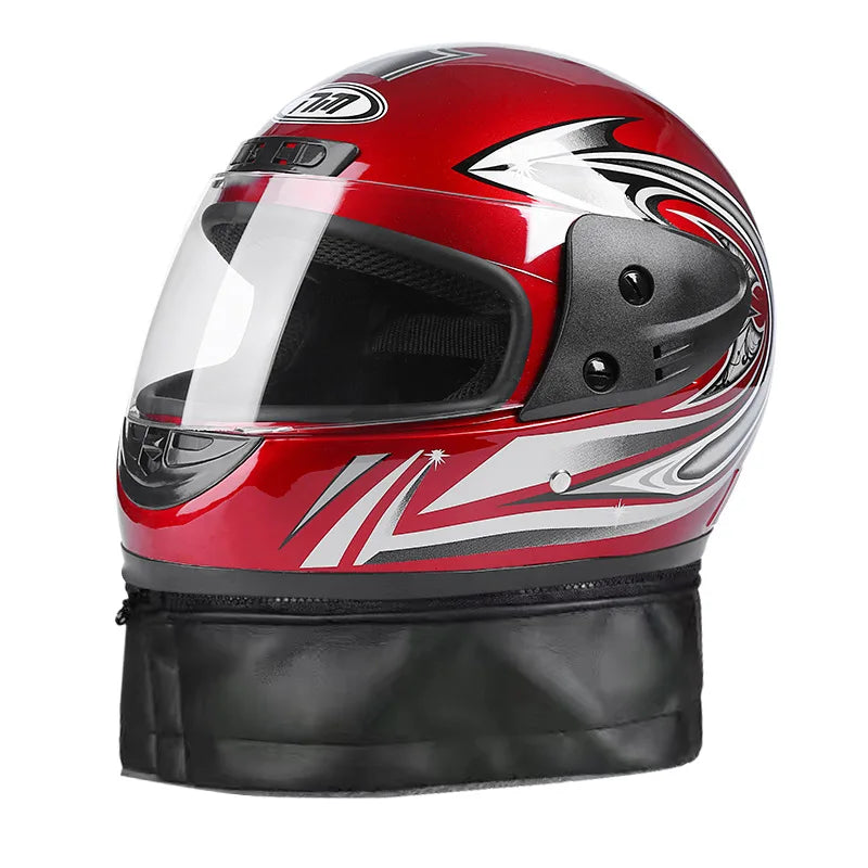 Red and black motorcycle helmet with a clear visor on a white background