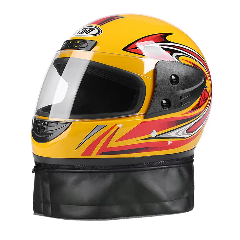 Yellow motorcycle helmet with red and black design on a white background